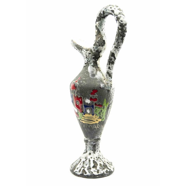 Terracotta pitcher is an original object realized in the 1970s. Original colored terracotta with decoration realized in...