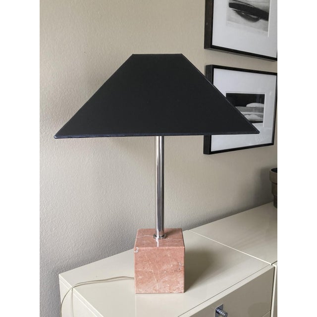 A modernist lamp with a pink marble cube base and a nickel column, made in Italy in the 1980s. The tapered square shade is...