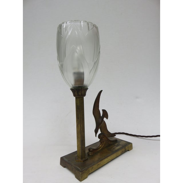An extraordinary table lamp, made in France during the Art Deco period. It is of high-quality craftsmanship. The base is...