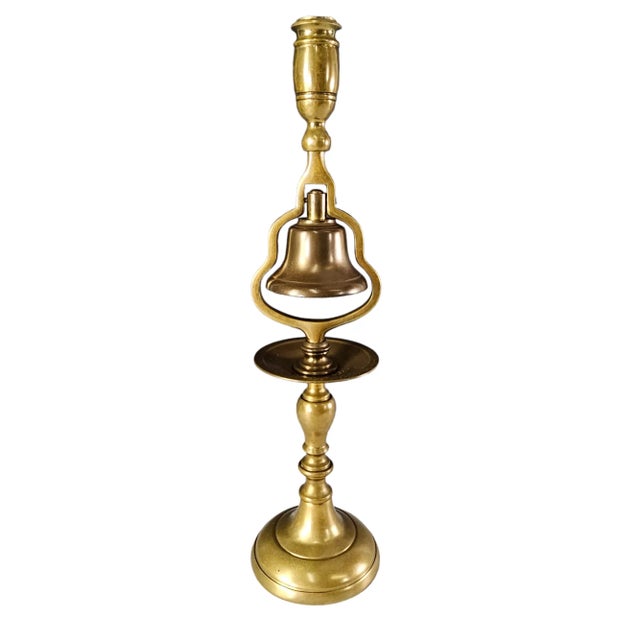 This vintage solid brass tavern bell candle holder hails from England in the mid-20th century. Crafted with intricate...
