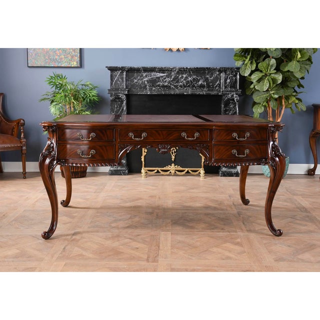 This Chippendale style Mahogany and Leather French Desk is produced by Niagara Furniture. A high quality writing desk that...