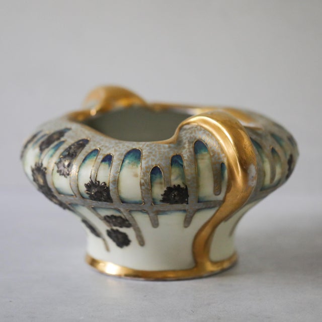 A beautifully decorated Art Nouveau two-handled bowl by Riessner, Stellmacher & Kessel, better known as Amphora, produced...