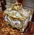 Exquisite French Rococo style jewelry box featuring elegant gilt bronze ormolu mounts and beautifully hand-painted...