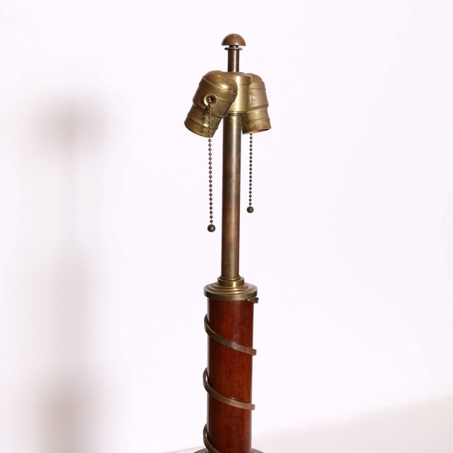 Single Classically styled table lamp in the form of a column decorated with bronze foliate bands at the top and bottom....