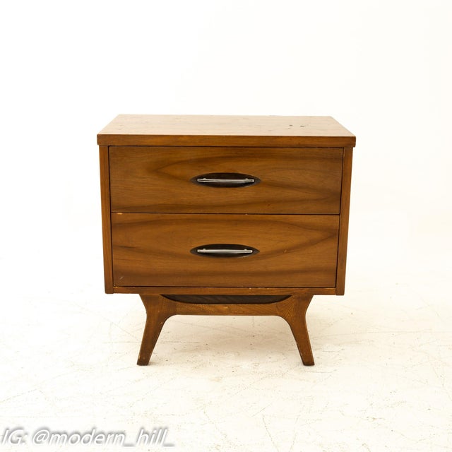 This listing is for a pair of Mid-Century Modern Walnut Nightstands. Featuring a straight line design, two drawers for...