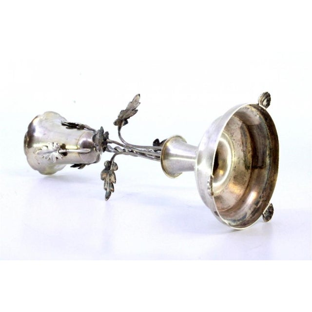 Silver toothpick holder with chalice supported by a twisted column and acanthus leaves on a guilloche base, resting on...