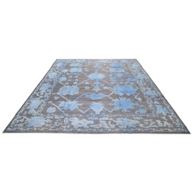 Hand-knotted with care using traditional rug-making techniques, this wool rug blends timeless craftsmanship with a modern...