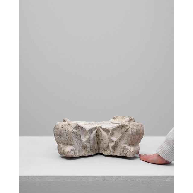 This 19th-century French architectural fragment captures the enduring elegance of classical design. Crafted from weathered...