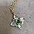 Created in 18 karat yellow gold Peridot 1.50 carats approx. Moon Quartz 4.50 carats approx. Diamonds 0.45 carat approx....
