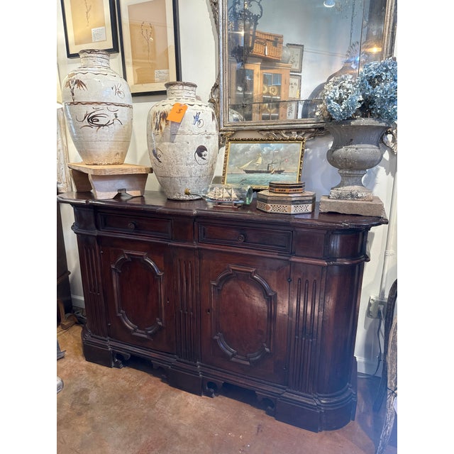 Walnut Italian credenza. Two drawers over two doors. Tuscan style. 65”l x 17.5”w x 37.5”h