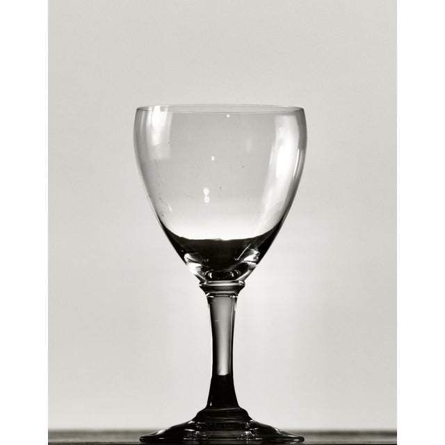 A set of eight French crystal cordial glasses by Baccarat, each signed on the underside of the foot with the acid-etched...