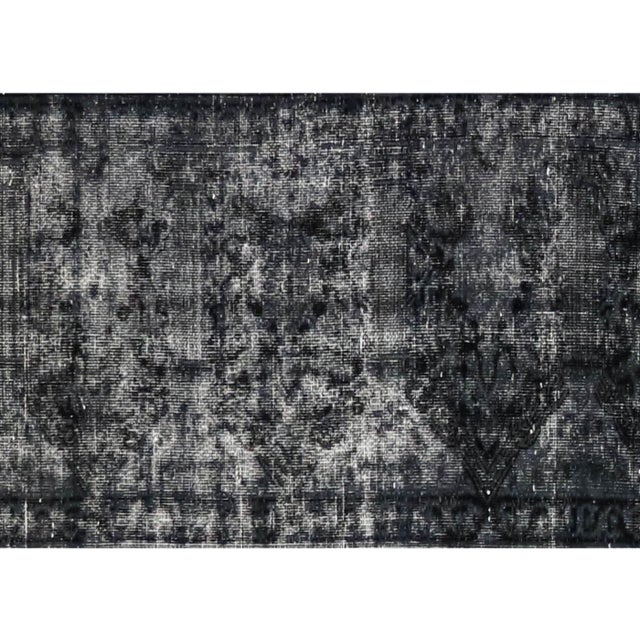 Expertly hand-woven in Iran using a wool on cotton foundation, the Vintage Persian Kerman Overdyed Runner has been...