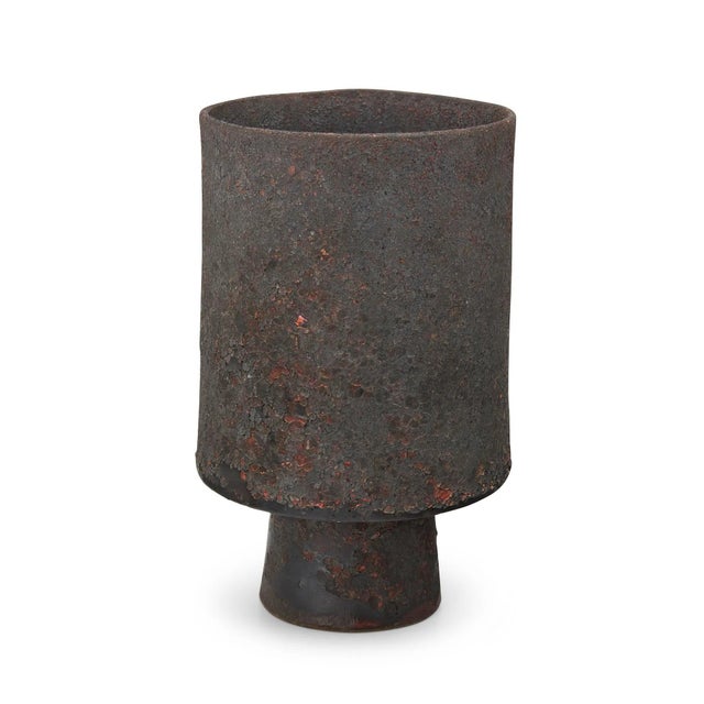 A bespoken ceramic vase in stemmed cylindrical form by Otto Natzler (1908-2007) made in 1990. The stoneware vase showcases...
