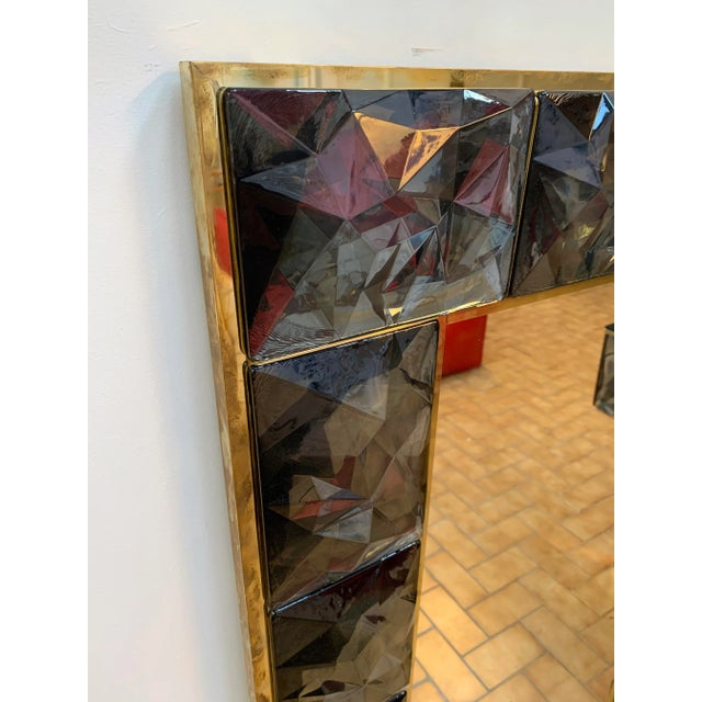 Contemporary wall mirror, full brass and large pieces of gray Murano glass with relief diamond point. Small artisanal...