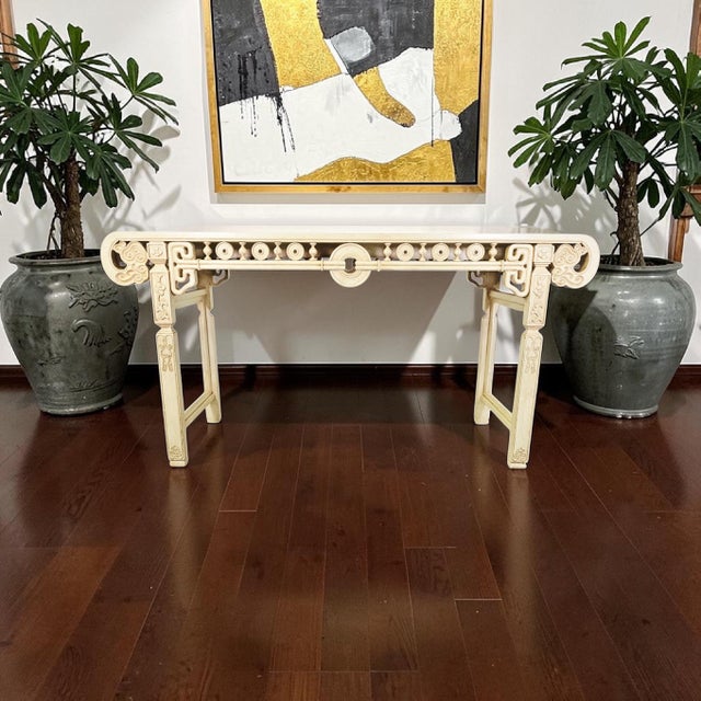 Large Asian Modern console table featuring an elegant cream lacquer finish with intricate geometric fretwork and Ming-...
