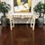 Large Asian Modern console table featuring an elegant cream lacquer finish with intricate geometric fretwork and Ming-...