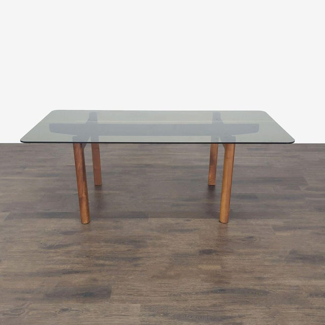 Designed by Shawn Place, the table features an oak base with a glass top. Brand: EQ3. Original Price: $1799. Dimensions...