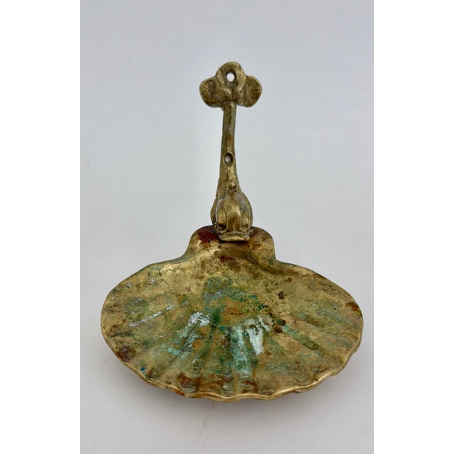 This Mid-century brass scallop shell dish originally purposed as a soap dish has been left with the perfect verdigris...