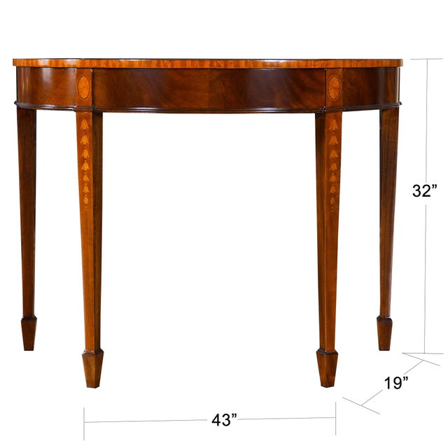 A high quality mahogany inlaid sunburst console table from Niagara Furniture which makes elaborate use of hand cut inlays....