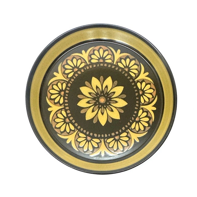 Floral warm-toned decorative plates, group of 7. This autumnal-inspired set of decorative plates features a variety of...