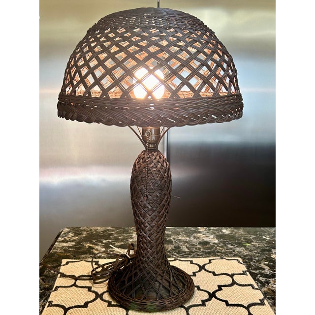 This wicker/rattan woven table lamp has a romantic air about it and brings a touch of the outdoors inside and can soften...