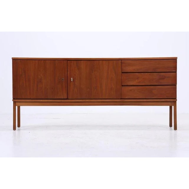 Beautiful sideboard from the 60s with compartments and drawers High-quality workmanship * Material: walnut * 2 shelves * 3...