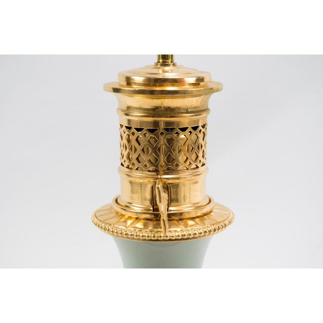 - Pair of bottle-shaped celadon porcelain lamps with on a gilt bronze mounting - Decoration of stylized vegetal frieze in...