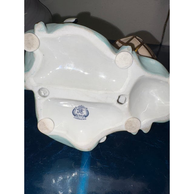 Pair of Capodimonte ceramic statues, man and woman, perfect from the 1960s. The male is 16 cm wide, 14.5 cm high and 16 cm...