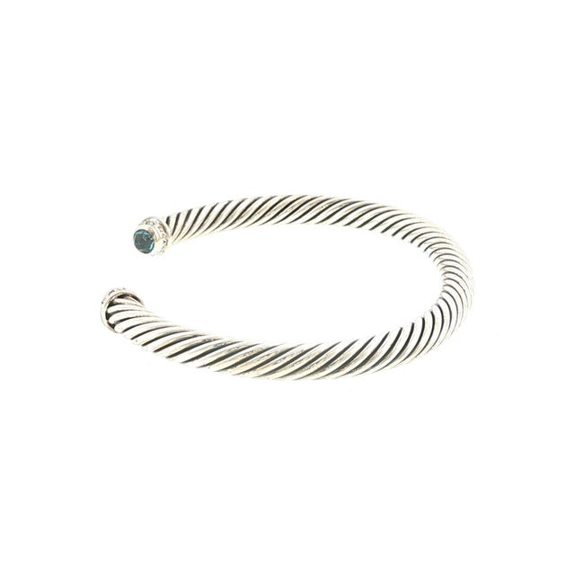A vintage David Yurman cuff bracelet, crafted in the United States. The bracelet features a 5mm twisted cable design. Each...