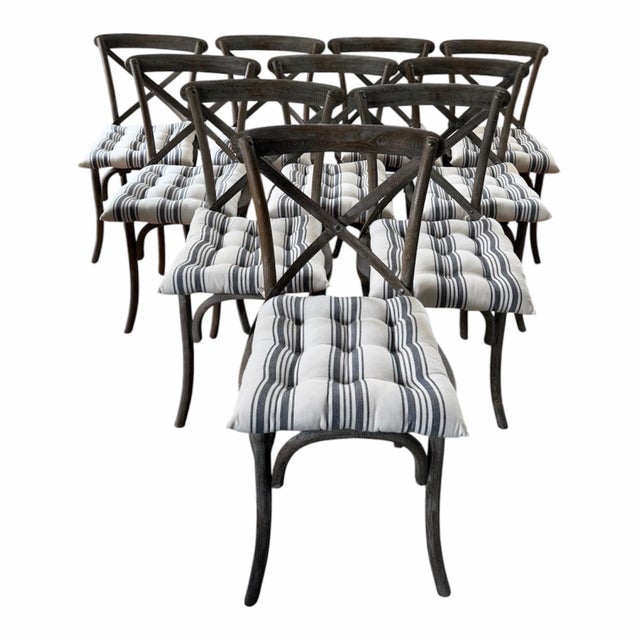 An exceptional set of 10 Restoration Hardware Madeline dining chairs crafted from solid oak with a beautifully weathered...