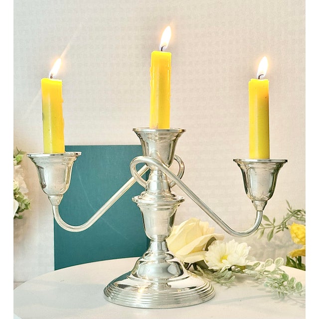 Elevate the ambiance of any dining or living space with the WM Rogers Sterling Candelabra. This exquisite 3-arm candle...