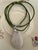Hand-carved, gourd-shaped jade pendant necklace, crafted from a highly translucent, icy white-to-pale-lavender jadeite...