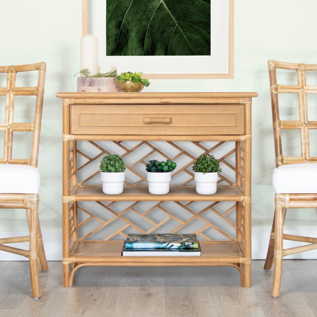 Elevate your living space with the timeless charm of the Chippendale End Table. The frame, crafted from rattan and leather...