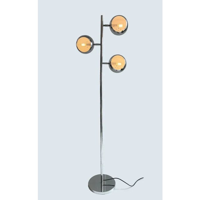Elegant lamp from the ground 1970s entirely in steel consisting of three sphere fires. Origin: Italy Dimensions: L45xh150x...