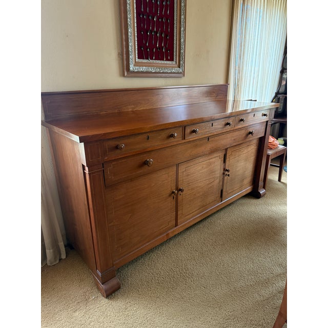 Description: Elegant antique sideboard with solid wood construction (likely mahogany or walnut). Features 3 upper drawers...