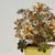 Delightful vintage Italian floral arrangement crafted with brass flowers decorated in enamel and presented in an alluring...