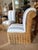 Set of two woven rattan slipper chairs newly upholstered in a crisp, timeless blue-and-white cabana stripe fabric. The...