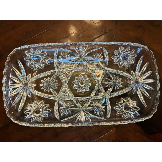 This is an oblong tray with rounded edges made of lead crystal. It is of molded glass, not cut or etched. The 12” length...