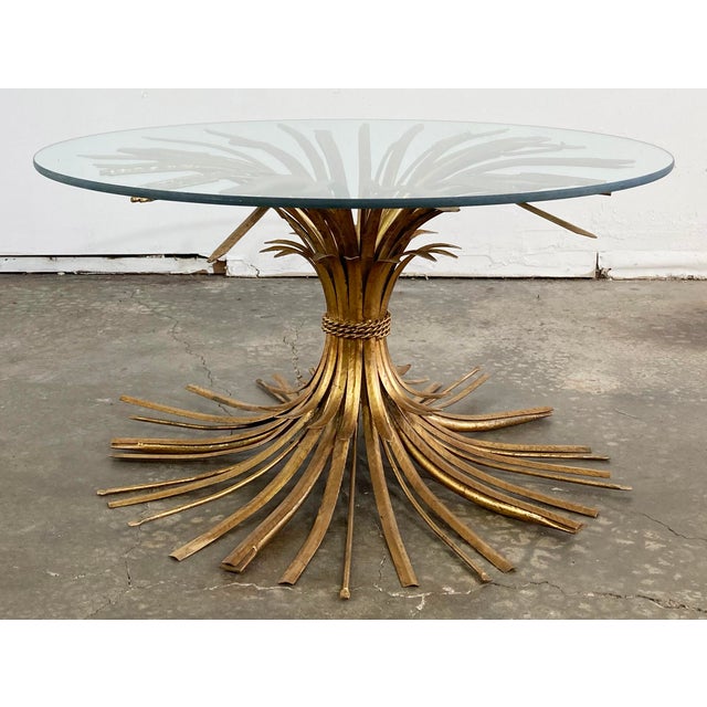 Statement vintage Mid-Century Coco Chanel Hollywood Regency style gilt metal sheaf of wheat table. Gorgeous piece that...