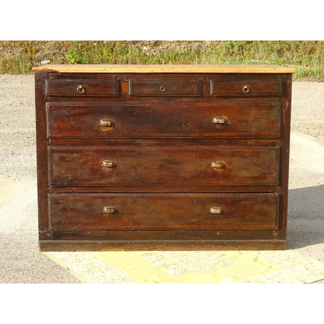 19th-century counter unit with a 2.7 cm thick pine top. It features three small drawers and three very large drawers, all...