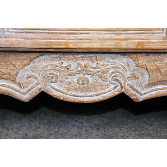 This exceptional 18th-century French Louis XV period buffet, crafted from solid oak and finished in a beautiful cérusé...