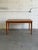 This dining table features a clean rectangular silhouette with integrated draw leaves for seamless expansion. Tapered legs...