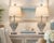 A striking pair of sculptural table lamps featuring dramatic coral-form bases finished in textured silver. Their highly...