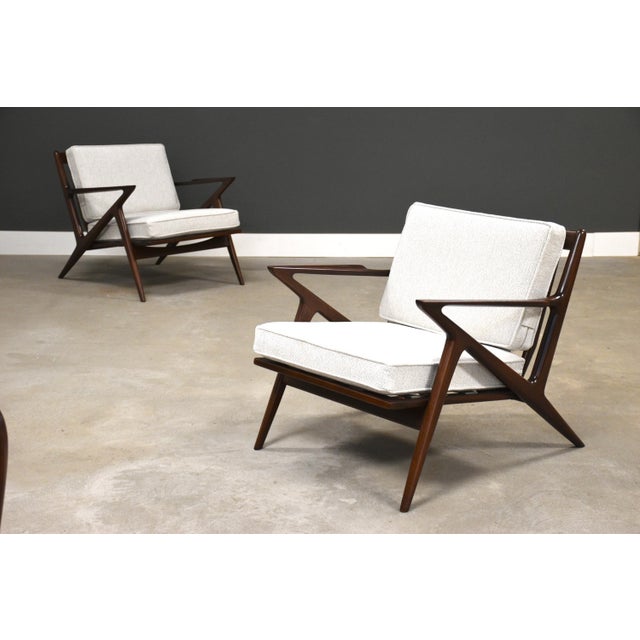 An original pair of mid century modern white fabric Z lounge chairs designed by Poul Jensen for Selig. Circa 1950’s....