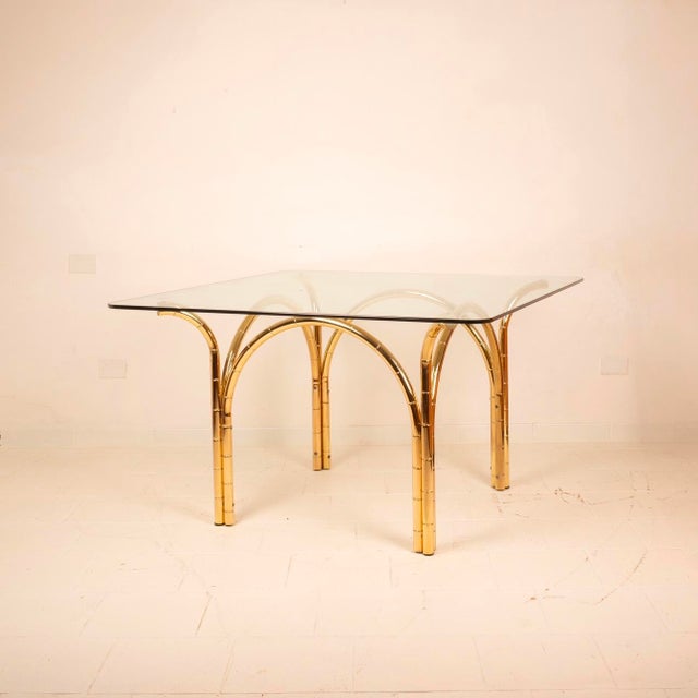Stunning brass table with bamboo effect and glass top, made in Italy in the 1970s. Excellent vintage condition as shown in...