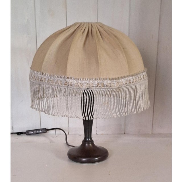 Vintage Table Lamp with Patinated Brass Base and Fringed Shade, 1980s, in Very Good conditions. Designed 1980 to 1989...