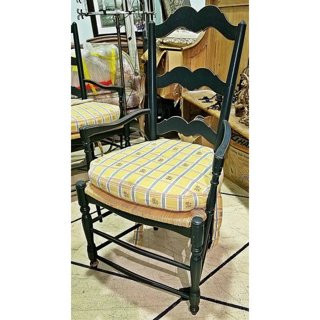 20th century French Country ladderback dining chairs in a set of 2 arms, rushed seats with tie on cushions, sturdy with 7...