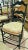 20th century French Country ladderback dining chairs in a set of 2 arms, rushed seats with tie on cushions, sturdy with 7...