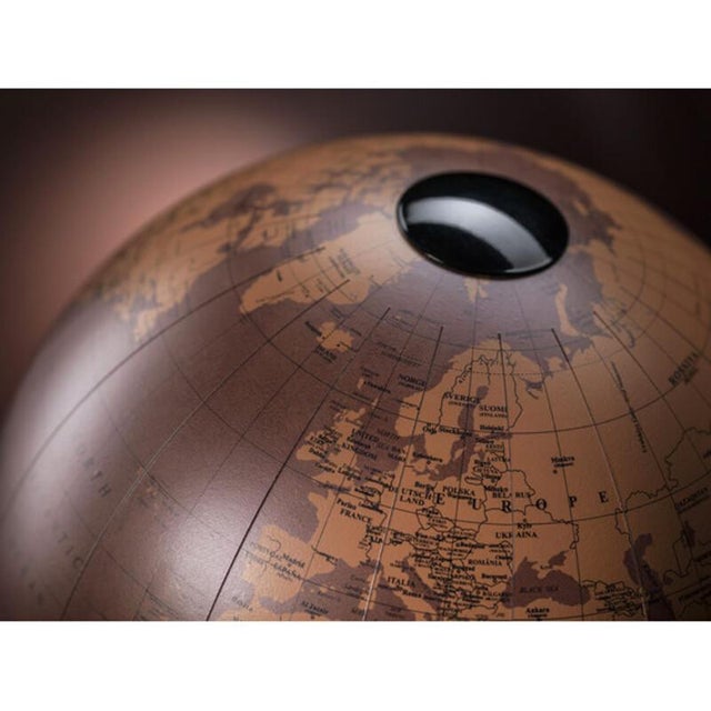 A globe that exudes elegance through detail. The handcrafted Italian beechwood base houses a techno-leather sphere,...