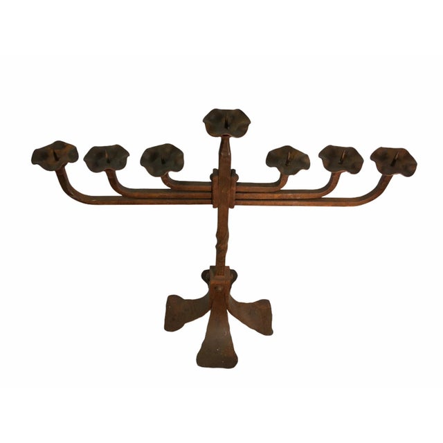 Handsome antique gothic revival candle holder. This pieces features a wrought iron body with an attractive patina. Holds...